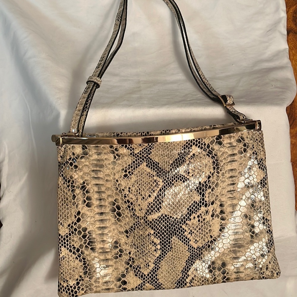 Danier leather with snake foil print purse.
